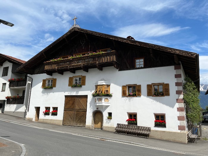 A sample of a house in Mutters.  Notice that many homes have some religious symbol displayed.